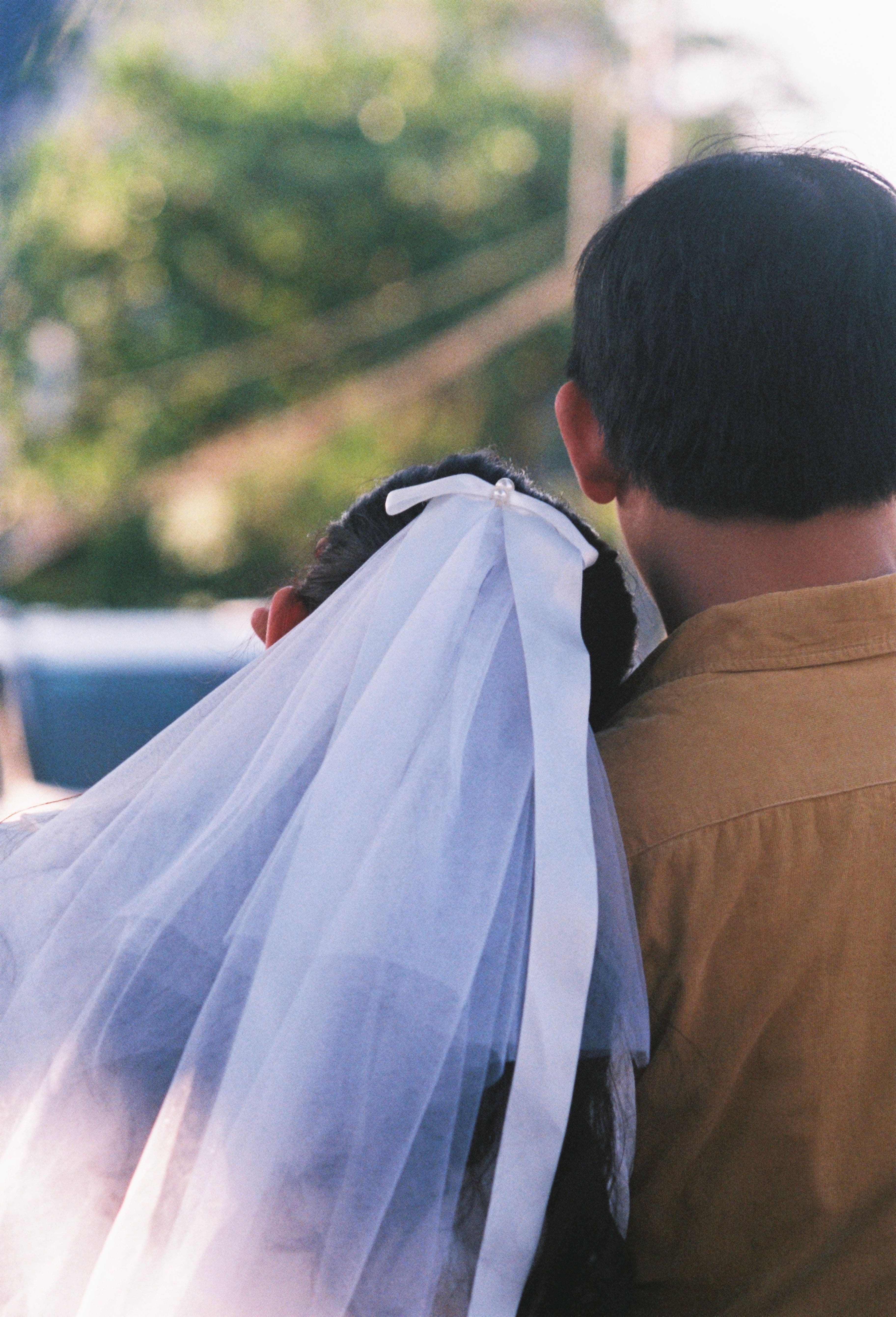 A quiet moment between a bride and her father